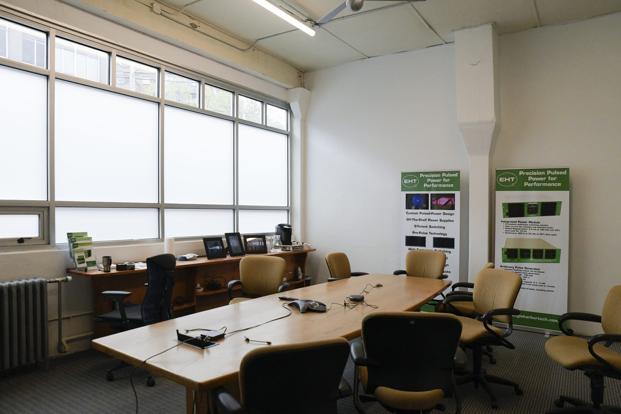 A bright and spacious work loft office interior at Northwest Work Lofts in Seattle Washington featuring large windows, high ceilings, and open workspace representing the affordable and versatile office spaces available in the historic Northwest Industrial Buildings