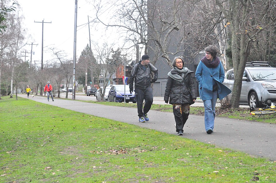 Walking on the Burke-Gilman Trail on the north shore of the Fremont Cut (Lake Washington Ship Canal), Fremont, Seattle, Washington.